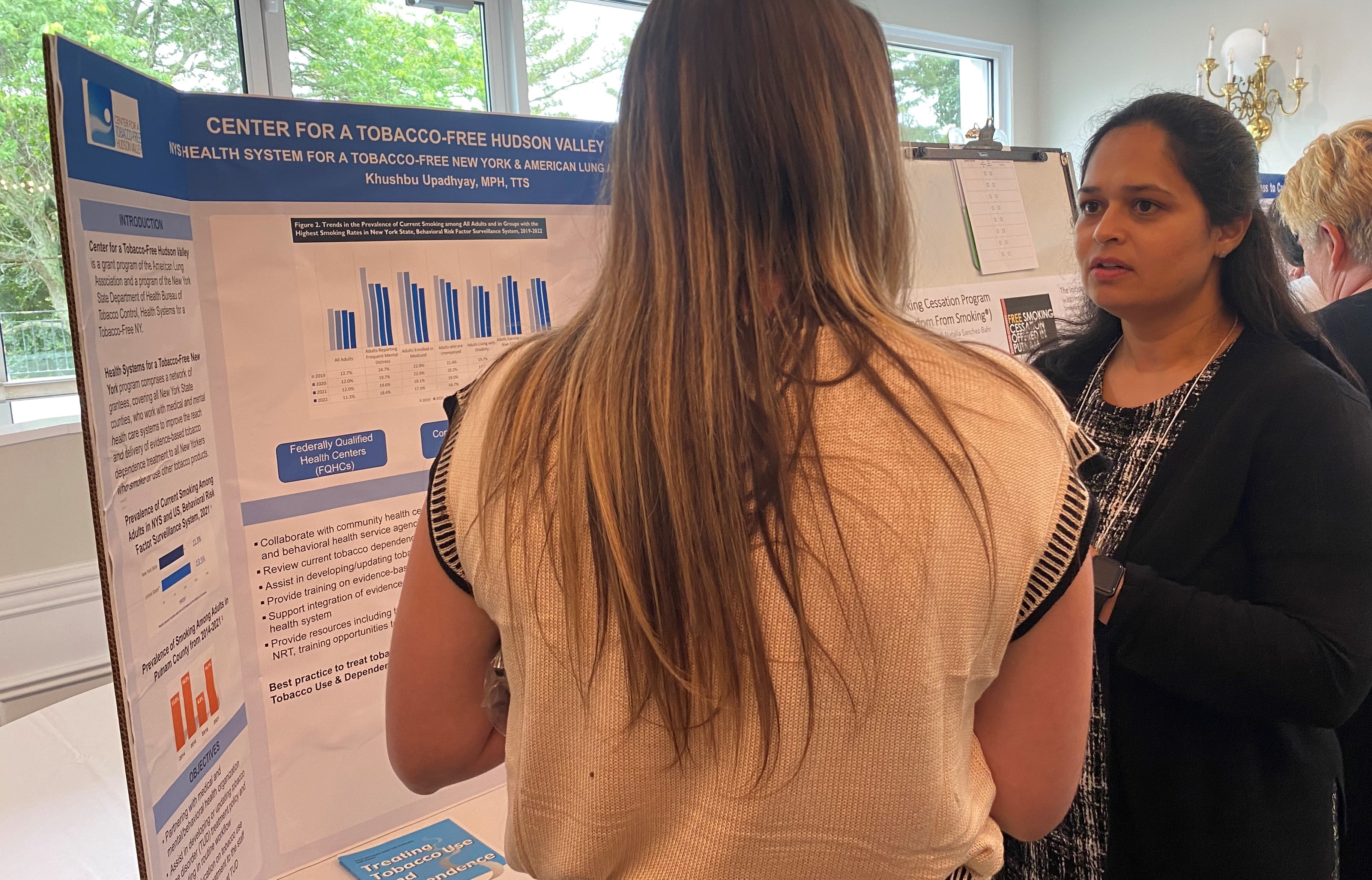 Khushbu Upadhyay, MPH, a health promotion specialist at the Center for a Tobacco Free Hudson Valley, American Lung Association, engages an attendee in conversation about initiatives championed by the Center. Smoking rates for residents of Putnam have recently increased by 6 percent from 2018 to 2021, making this work even more necessary.